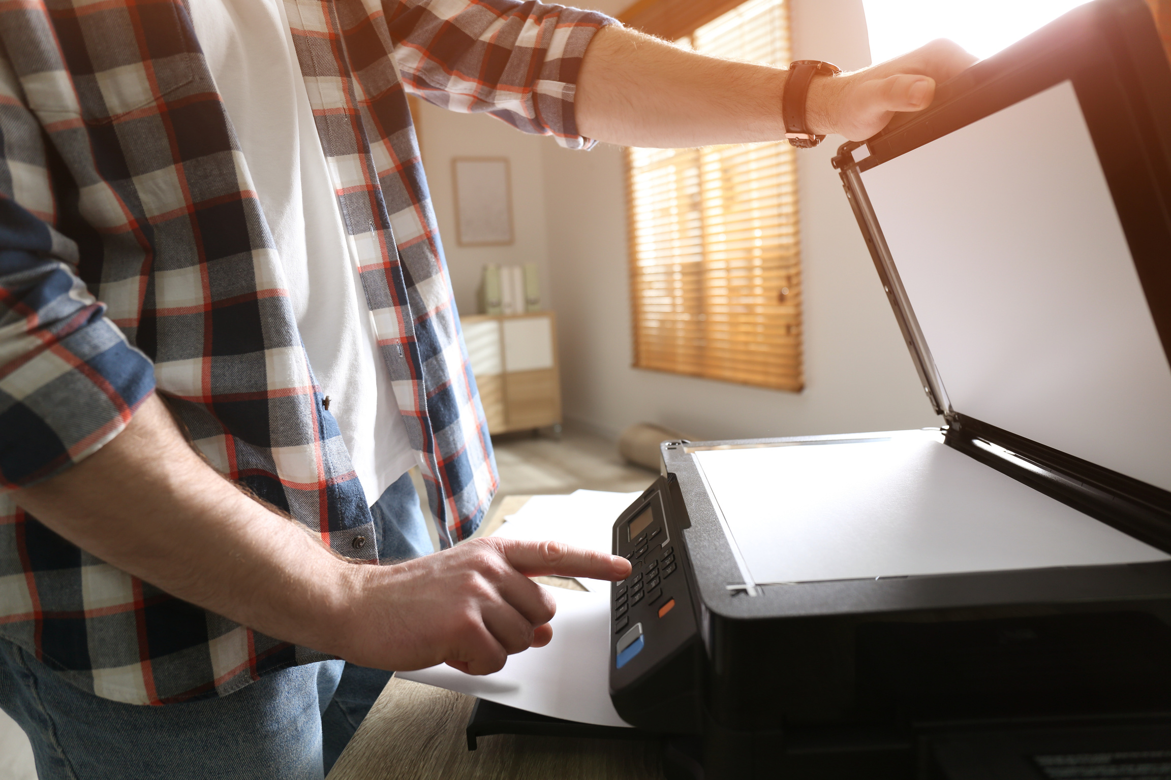 Man Using Modern Multifunction Printer in Office, Closeup